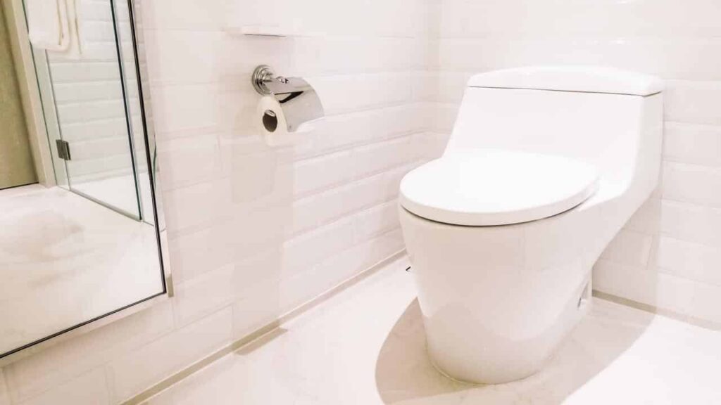 Bathroom sink and toilet in a clean interior