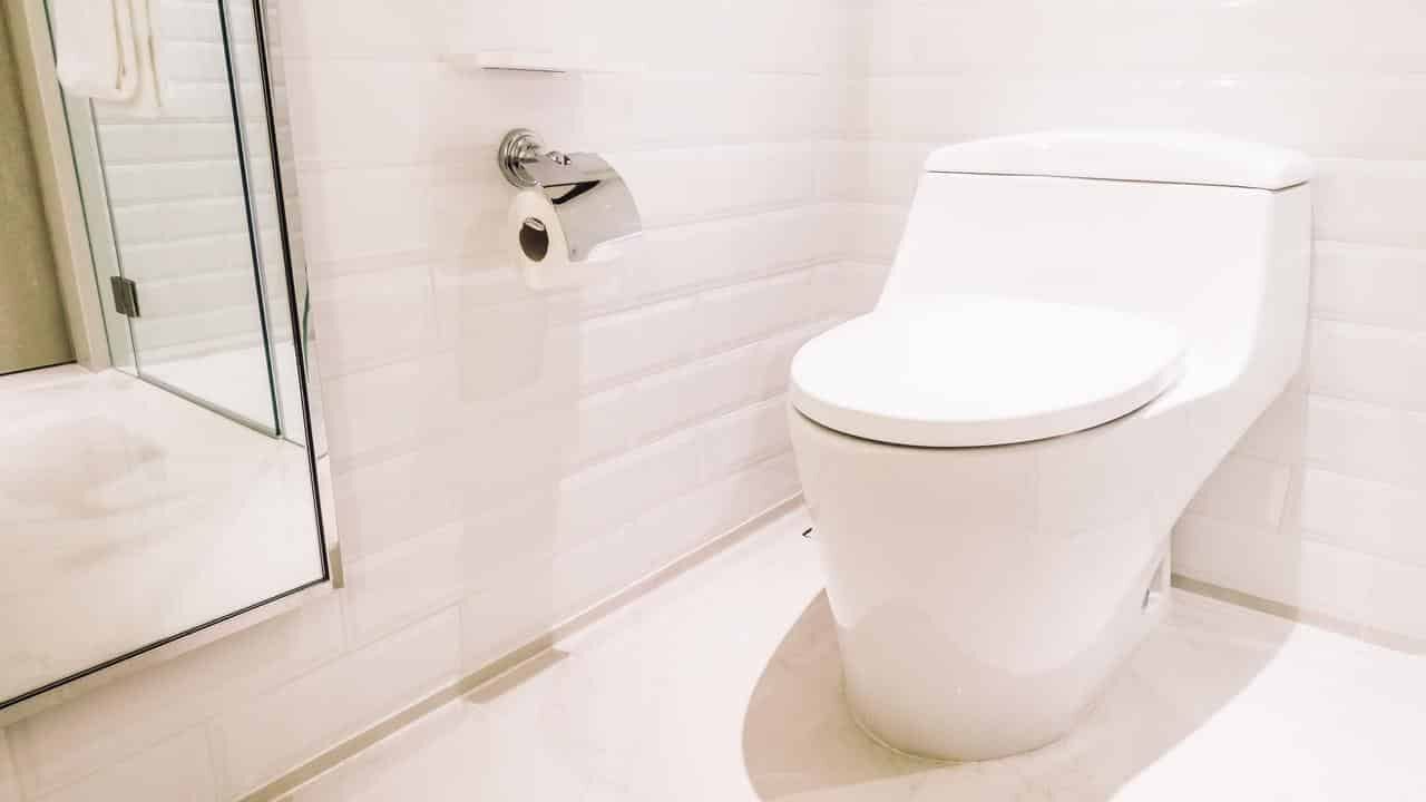 Bathroom sink and toilet in a clean interior