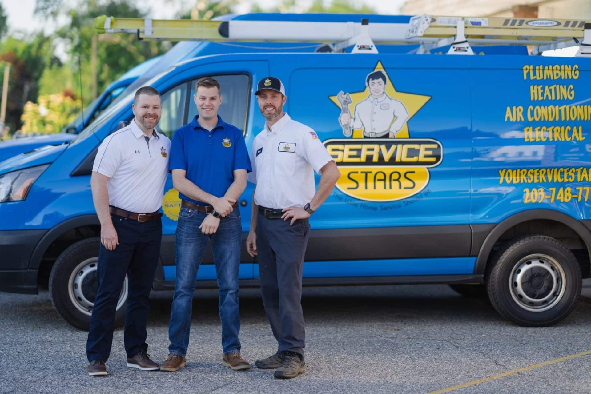 ServiceStars Team outside one of our vans.