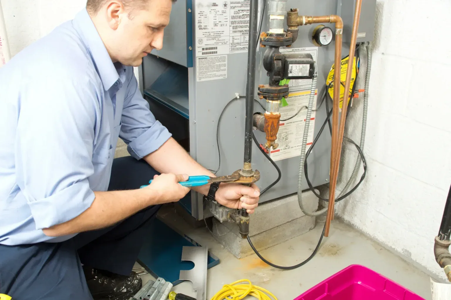 Technician servicing a water heater