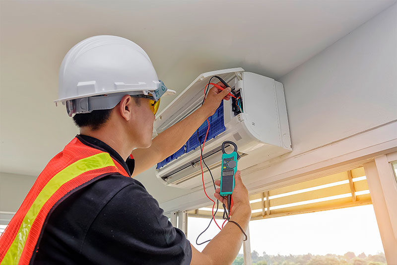 HVAC technician working on a ductless mini split